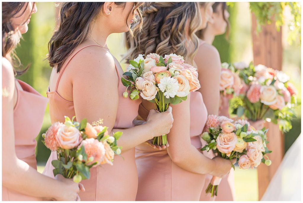 bridesmaids in pink and coral for viansa wedding day