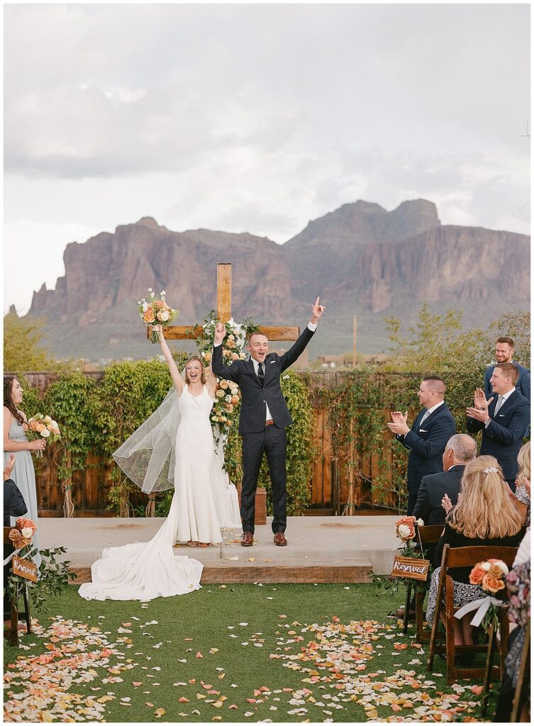 The paseo wedding ceremony in Arizona with wooden cross
