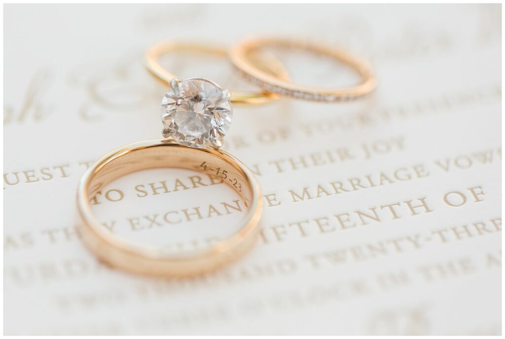 Engagement ring on letterpress wedding invitation