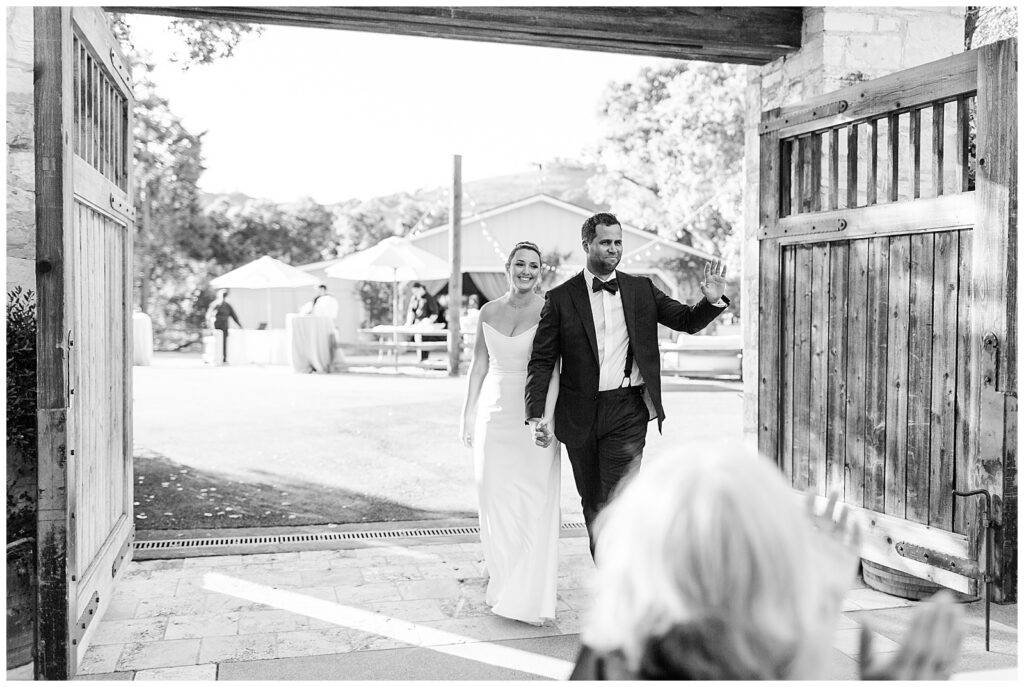 couple making entrance to Holman Ranch wedding reception