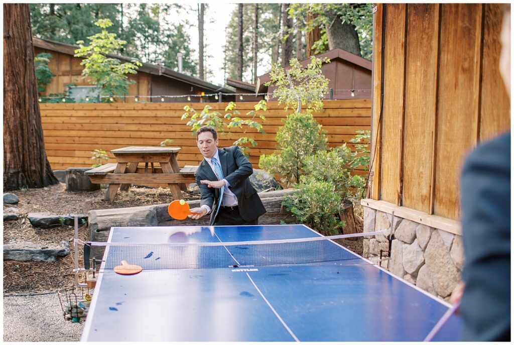 guests playing ping pong at wedding at Evergreen Lodge Yosemite