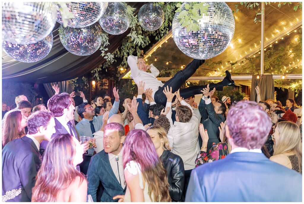 Wedding reception under disco balls at Evergreen Lodge Yosemite Wedding with Take2 Dance Band