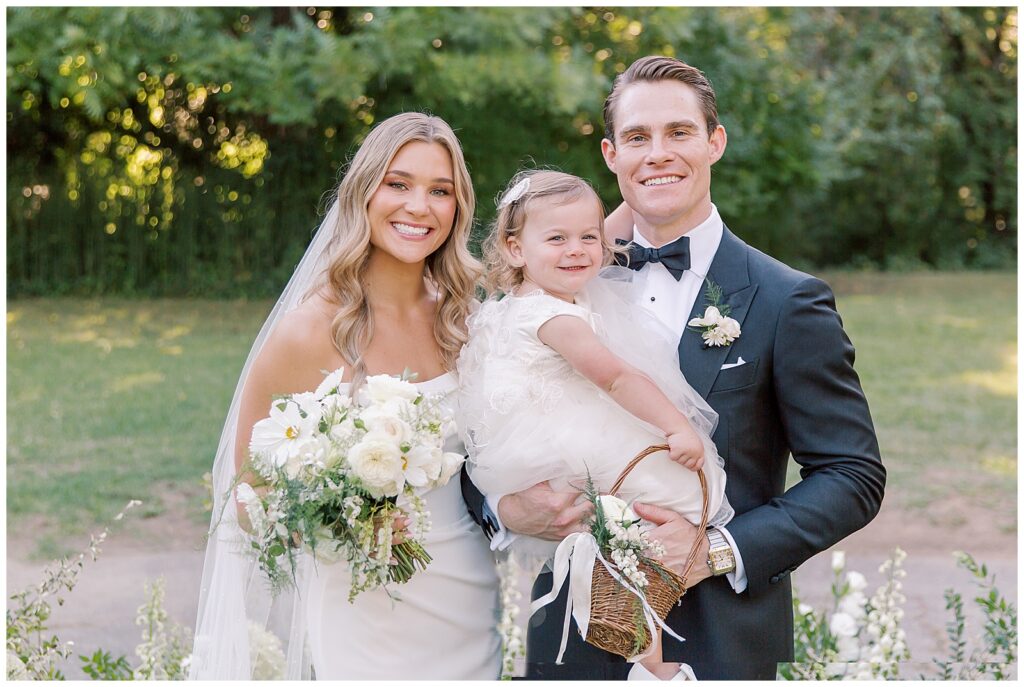 Bride and groom with flower girl at Dawn Ranch wedding