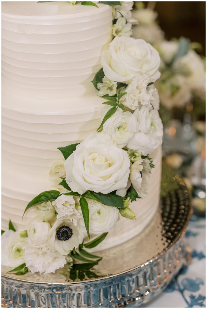 Three tiered wedding cake with florals