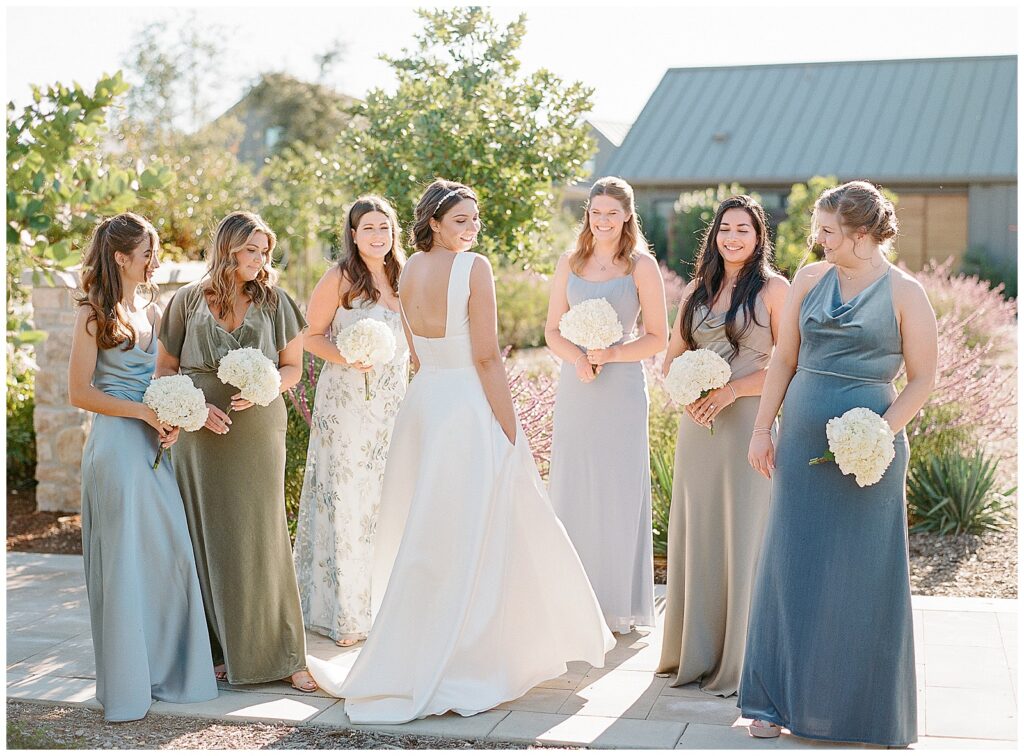 bridesmaids in blue and green mismatched dresses