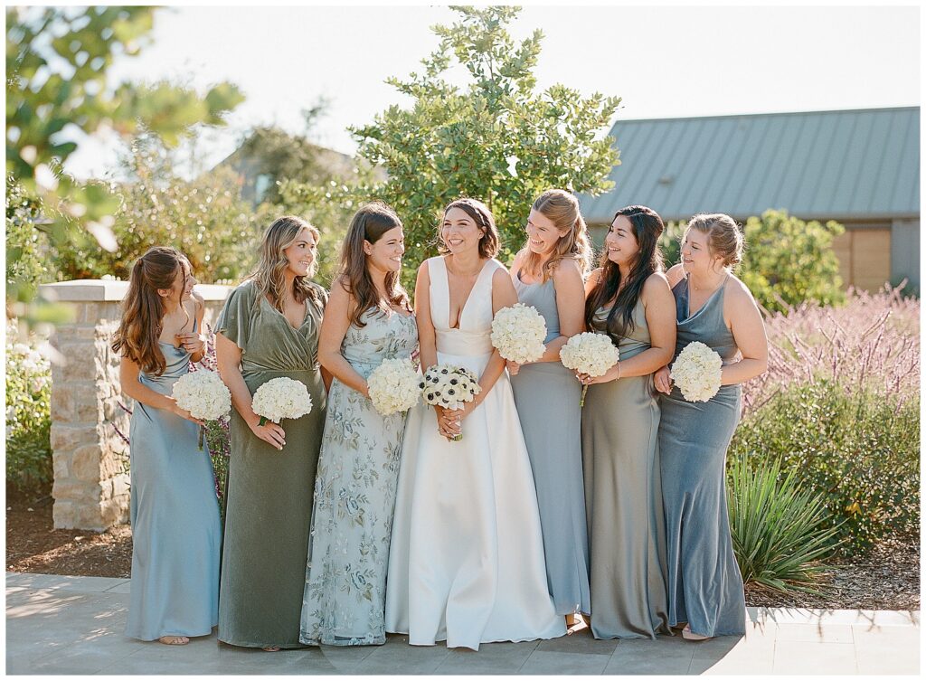 bridesmaids in blue and green mismatched dresses for wedding at Stanly Ranch