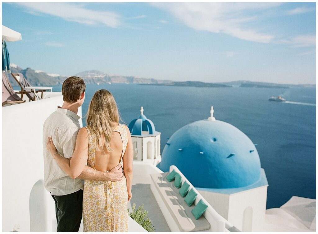 Engagement photos in Oia Santorini at the blue domes