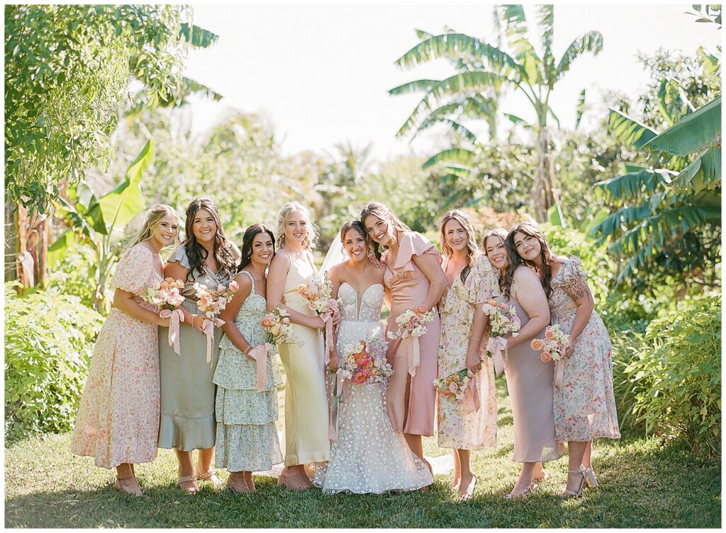 Bridesmaids with mismatched pastel dresses at Jubilee Estate Wedding