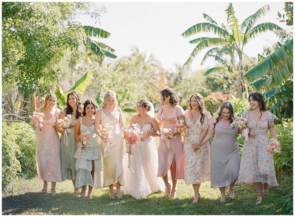 Bridesmaids with mismatched pastel dresses at Jubilee Estate Wedding