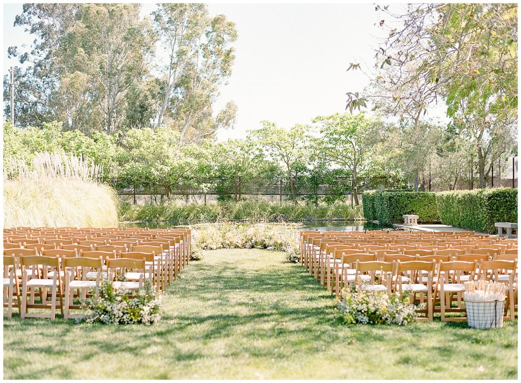 Yellow springtime low ceremony install at Cornerstone Sonoma wedding